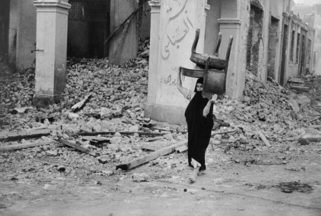 Woman Carrying a Chair Chim, Port Said, Egypt, 1956
